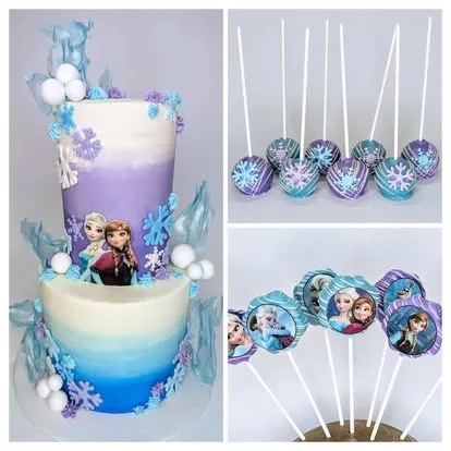 A Frozen-themed cake with Elsa and Anna decorations, accompanied by matching cake pops and cupcake toppers