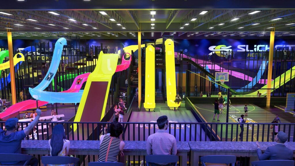 Large indoor slide park at Slick City featuring giant colorful slides, play areas and family attractions.